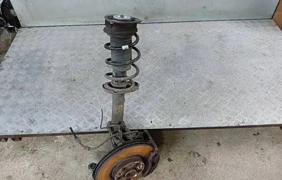Front wheel hub spindle knuckle