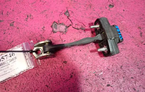 Front door check strap stopper