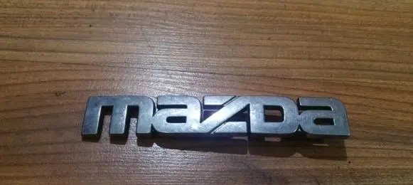 Mazda 626 Manufacturer badge logo/emblem 
