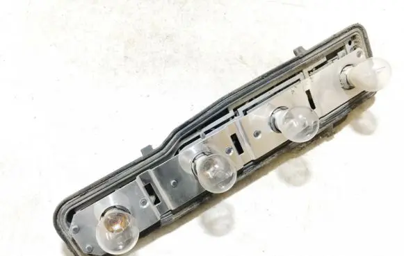 Ford Escort Tail light bulb cover holder