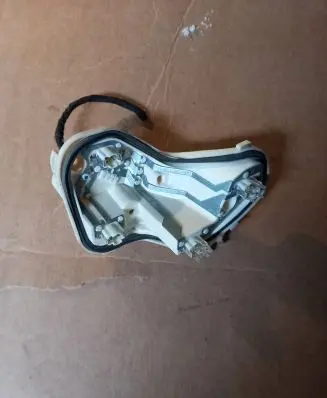 Tail light bulb cover holder