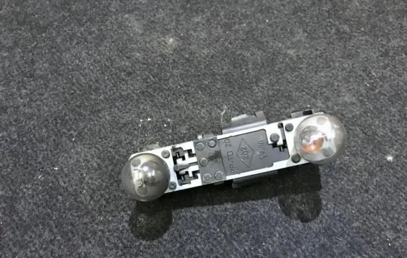Renault Laguna I Tail light bulb cover holder