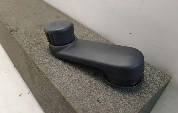 Dacia Sandero III Rear door window winding handle 807604387R