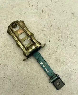 Front door check strap stopper