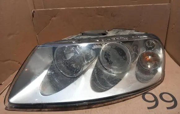 Volkswagen Touareg I Headlight/headlamp 89308471