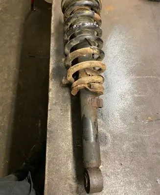 KIA Sorento Front shock absorber with coil spring 3E023
