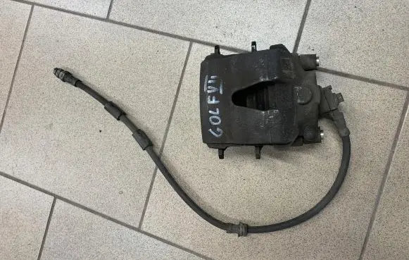 Volkswagen Golf VII Front brake caliper