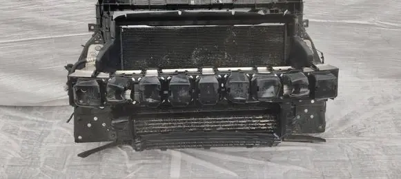 Radiator support slam panel