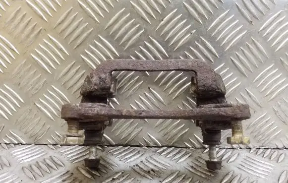 Subaru Legacy Brake caliper pad carrier rear 