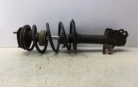 Nissan Almera N16 Front shock absorber with coil spring 