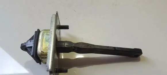 Front door check strap stopper