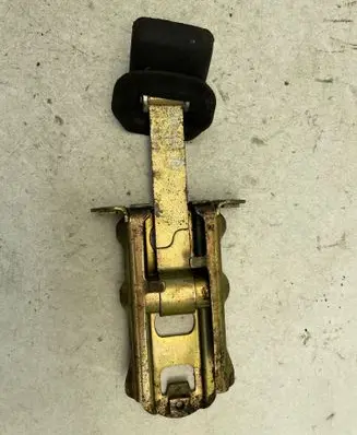 Front door check strap stopper