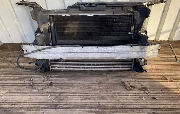 Radiator support slam panel