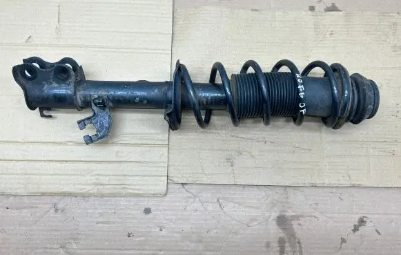 Nissan Note (E12) Front shock absorber with coil spring 543023WF0C 46020MC