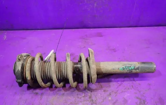 Volkswagen Caddy Front shock absorber with coil spring 