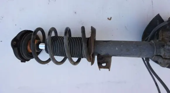 Volkswagen Scirocco Front shock absorber with coil spring MCPERSON
