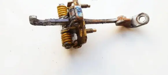 Front door check strap stopper