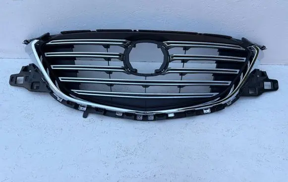 Mazda CX-9 Front bumper upper radiator grill TK4950712