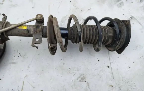 Front shock absorber with coil spring