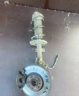 Citroen Berlingo Front shock absorber with coil spring