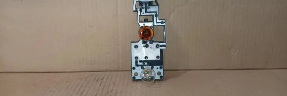 Tail light bulb cover holder