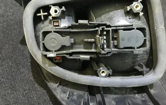 Tail light bulb cover holder