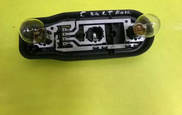 Tail light bulb cover holder