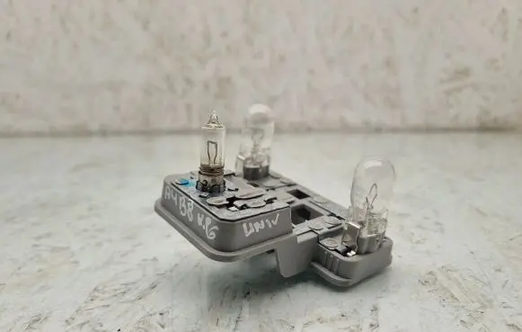 Tail light bulb cover holder
