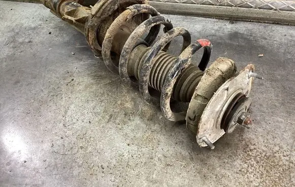 Volvo XC90 Front shock absorber with coil spring 31277877