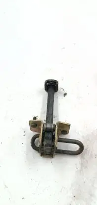 Front door check strap stopper