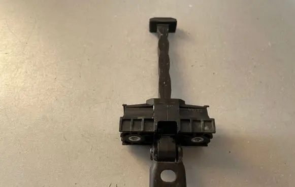 Rear door check strap stopper