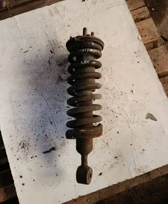 Nissan Pathfinder R51 Front shock absorber with coil spring