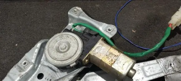 Mazda Demio Front door window regulator motor 