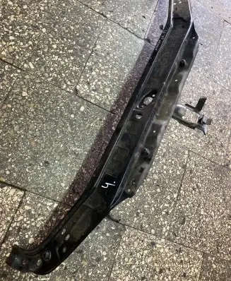 Radiator support slam panel bracket