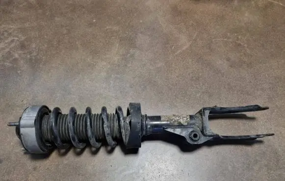 Volkswagen Touareg II Front shock absorber with coil spring 7P6413031
