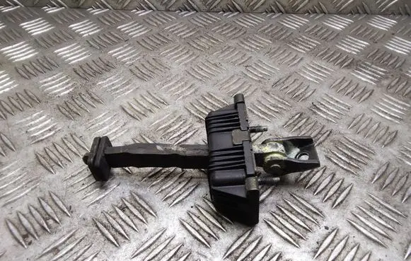 Front door check strap stopper