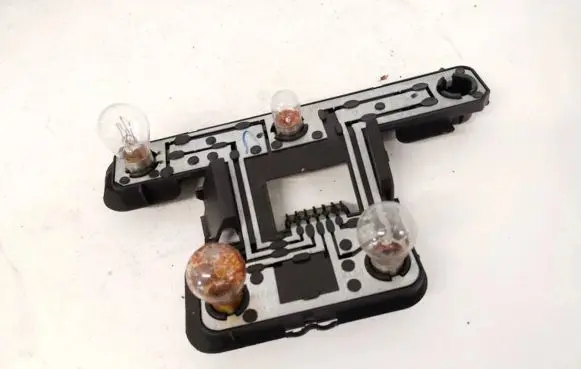 Tail light bulb cover holder