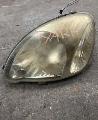 Toyota Yaris Headlight/headlamp 811500D09000 89007616