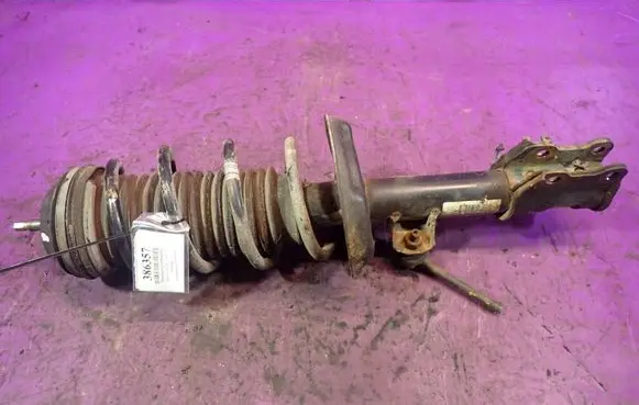 Opel Corsa D Front shock absorber with coil spring 
