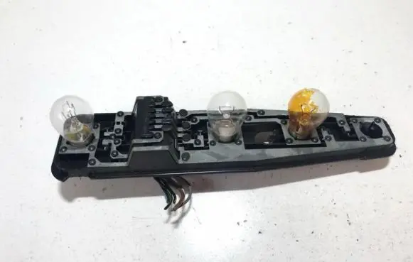 Tail light bulb cover holder