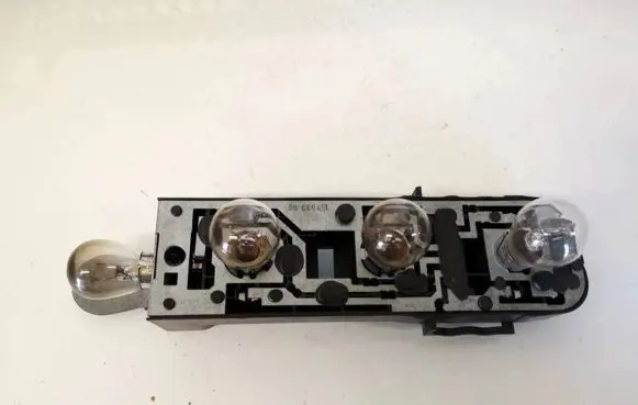 Tail light bulb cover holder