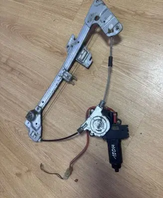 Mazda 323 F Front door window regulator with motor