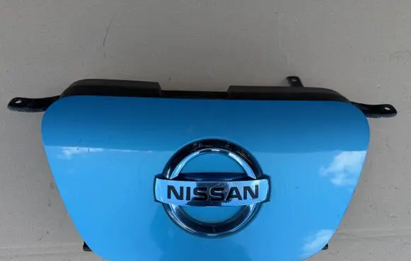 Nissan Leaf I (ZE0) Electric car charge socket cover 657303NA1A