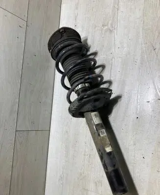 Volkswagen Golf VII Front shock absorber with coil spring 5Q0412014MD