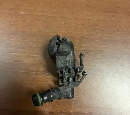 Headlight washer spray nozzle
