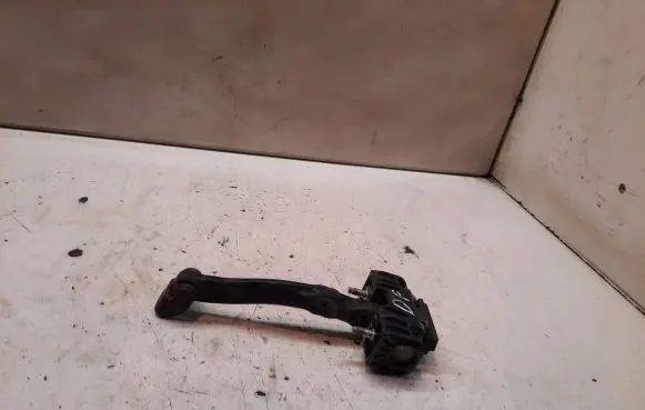 Front door check strap stopper
