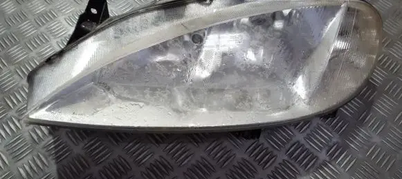 Renault Megane I Headlight/headlamp 7701047184