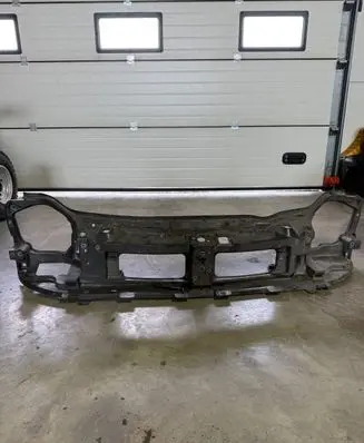 Top upper radiator support slam panel