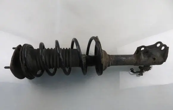 Front shock absorber with coil spring