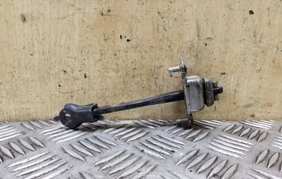 Subaru Legacy Rear door check strap stopper